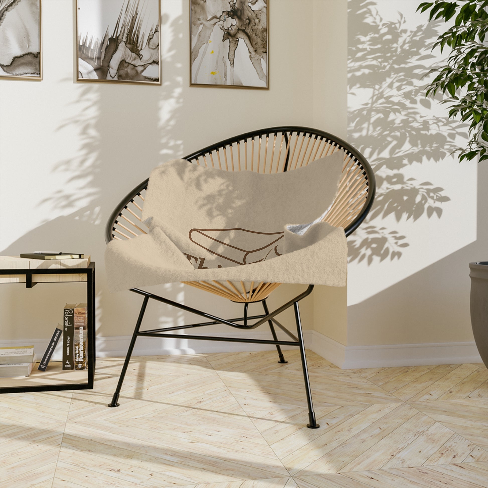 This Is My Reading Blanket draped over cozy reading chair in hygge style nook with books and plant