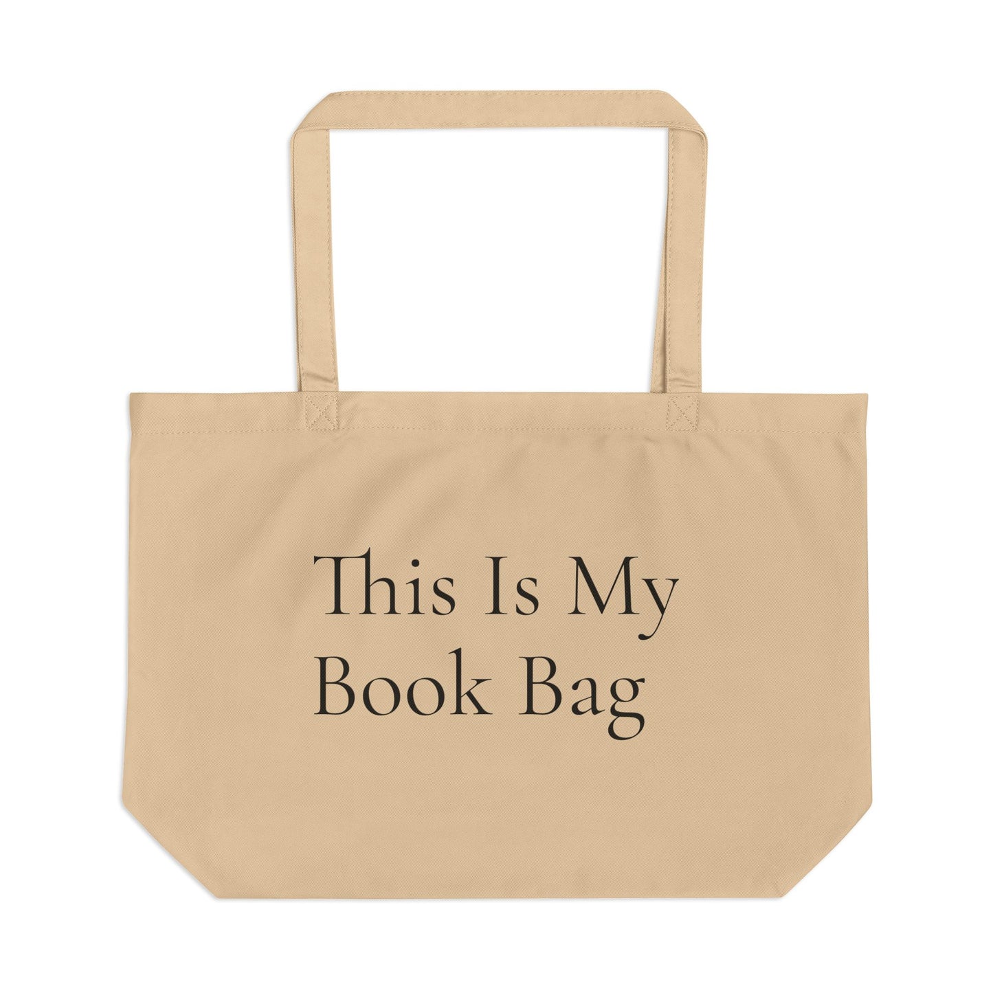 Beige Oyster tote bag with the phrase ‘This Is My Book Bag’ printed in warm serif typography — Cozy Reading Nook Collection.