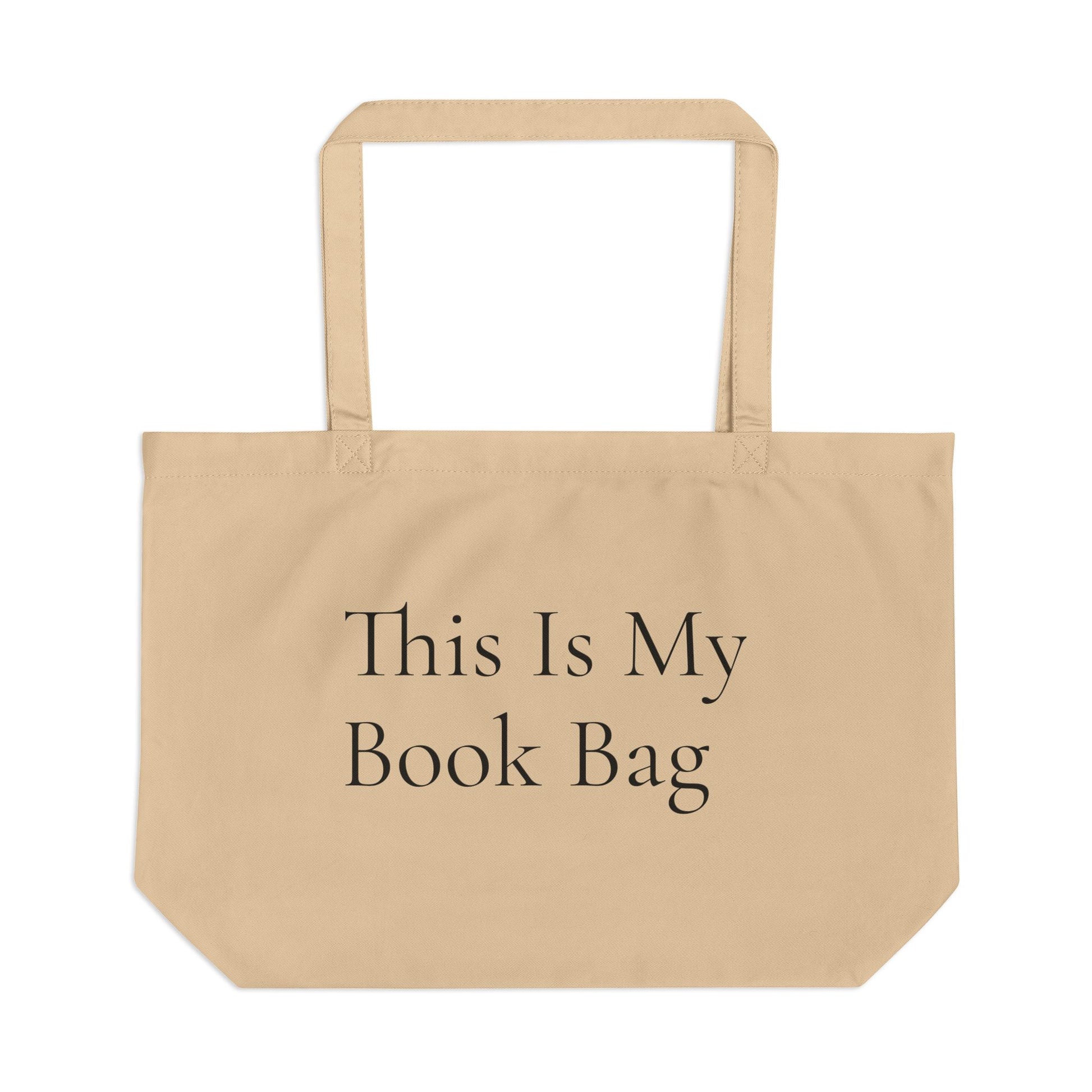 Beige Oyster tote bag with the phrase ‘This Is My Book Bag’ printed in warm serif typography — Cozy Reading Nook Collection.